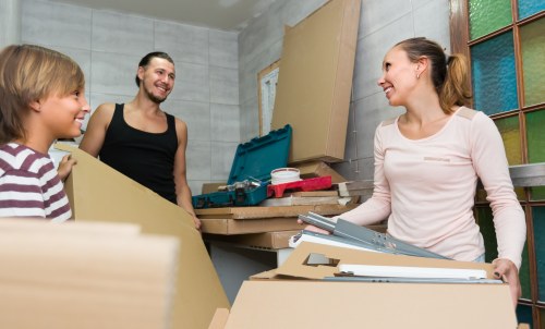 Professional movers preparing furniture for pick-up