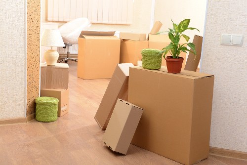 Movers packing items carefully